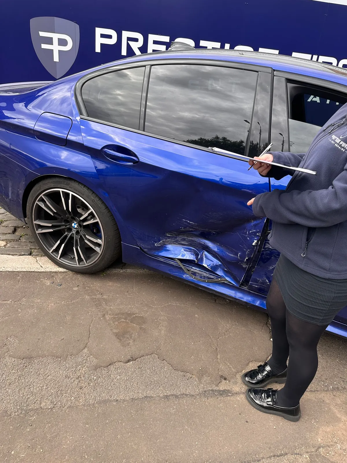 Accident damaged vehicle being assessed for an insurance repair